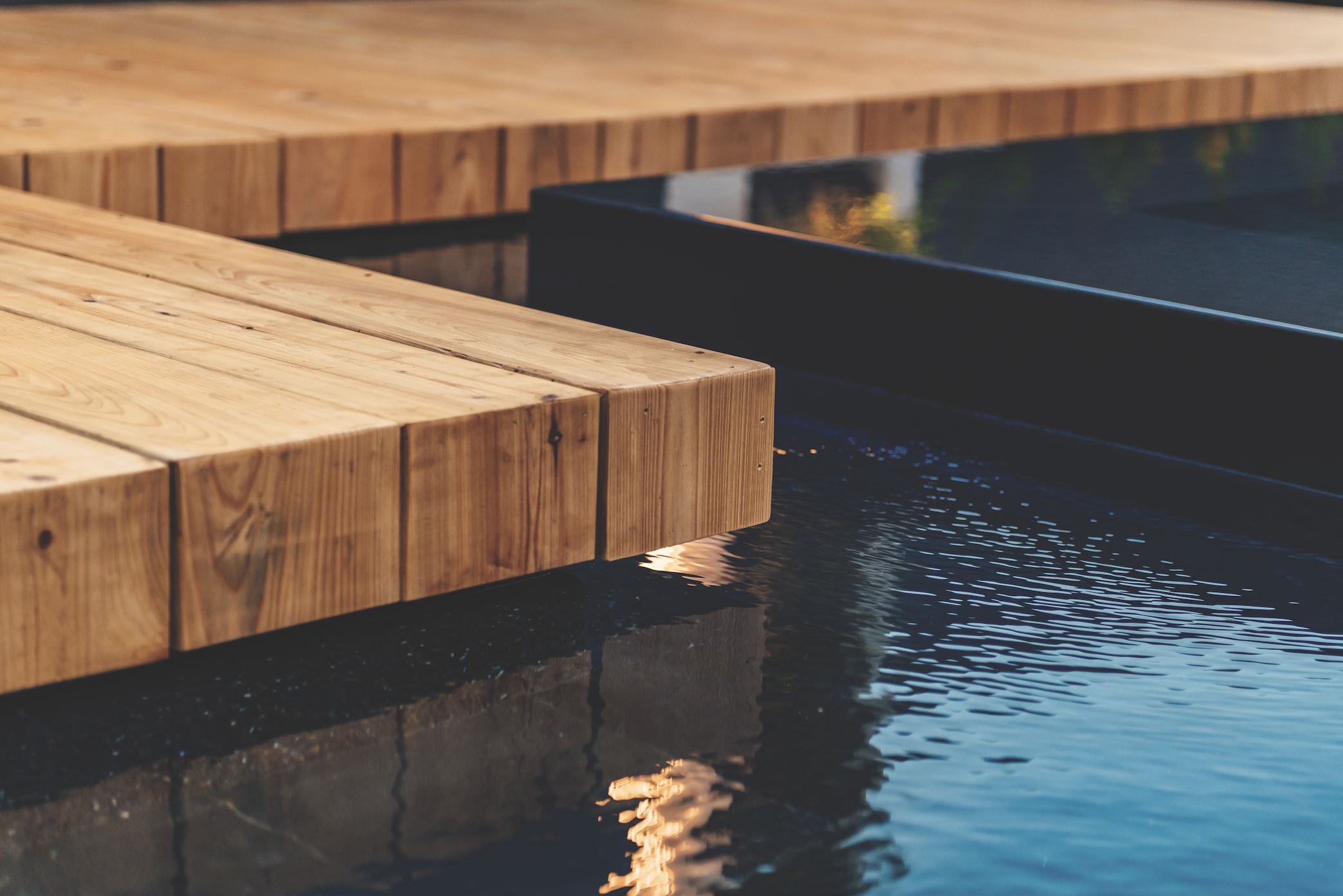 Detail shot of the wood decking and pools edge