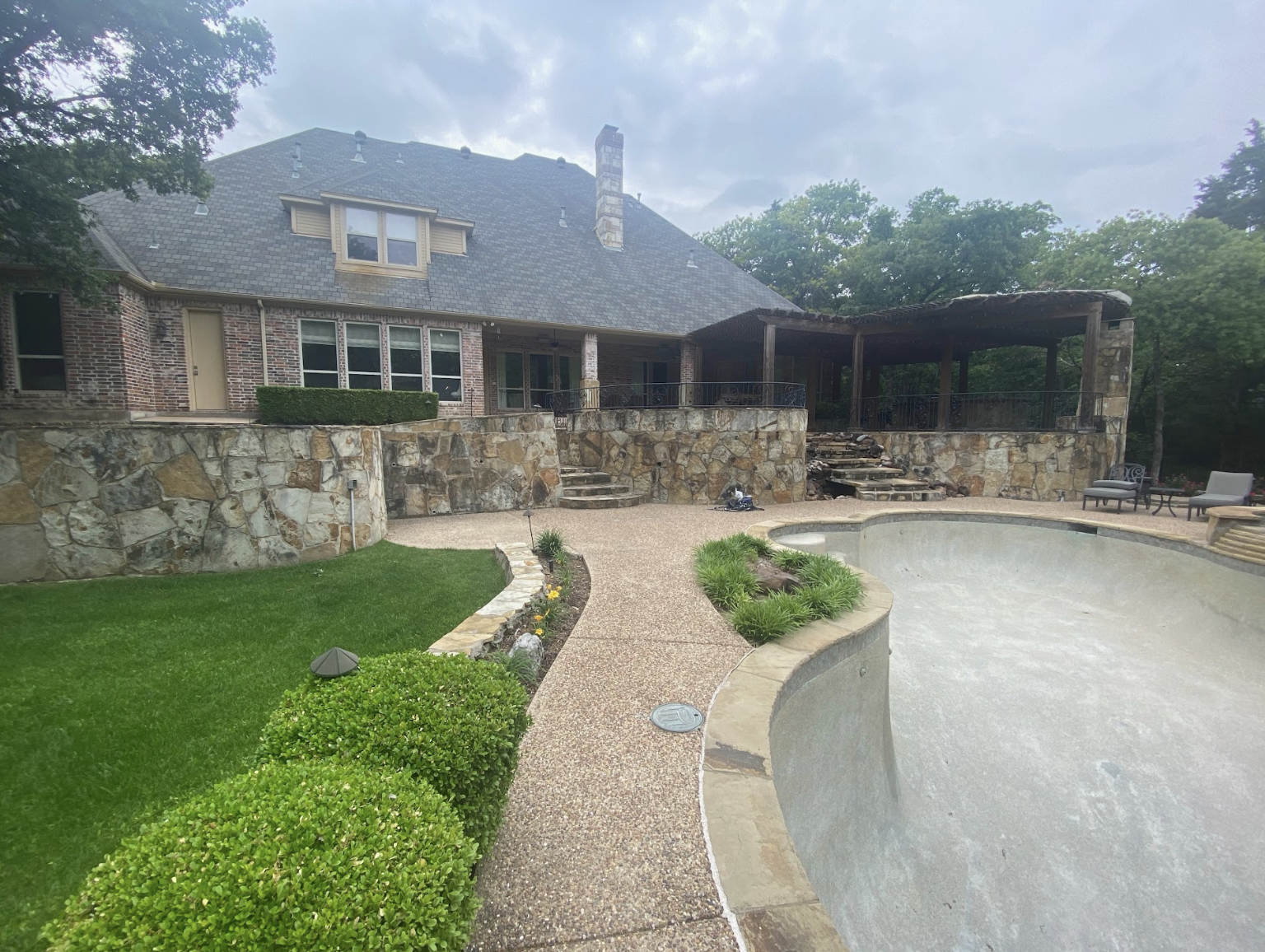 Residence before the back yard renovation by Mike Farley, owner of Farley Pool Designs