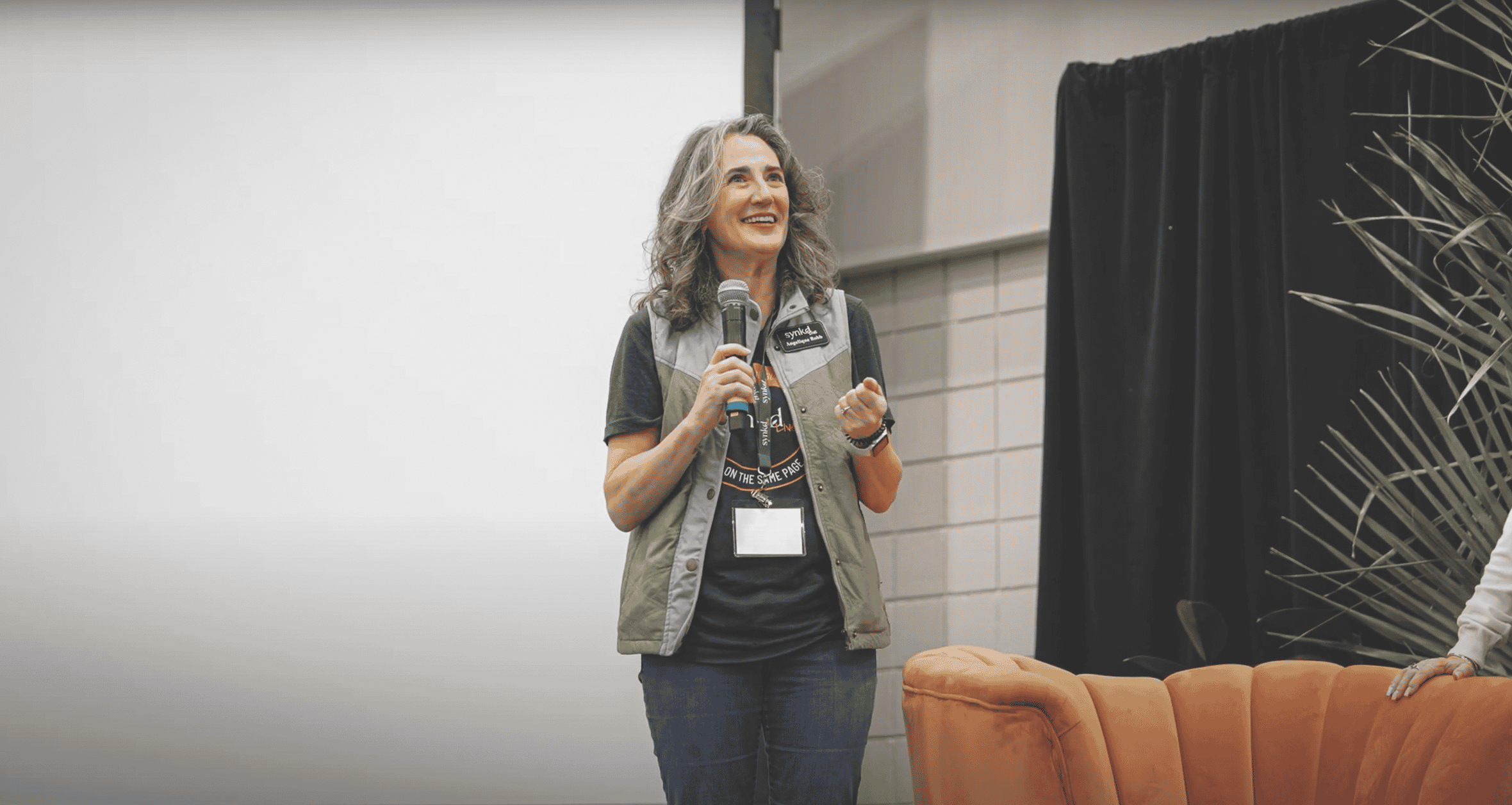 Angelique Robb, Founder of SYNKD, on stage at SYNKD Live 2024